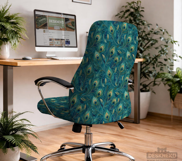A blue green chair cover with a peacock feather design shown on an office chair with armrests.