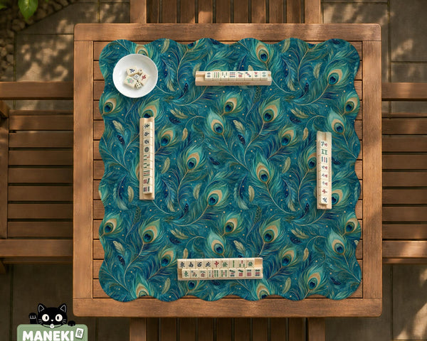 Teal mahjong mat with a peacock feather pattern in blue green tones.