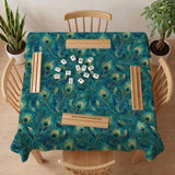Teal mahjong mat with a peacock feather pattern in blue green tones.