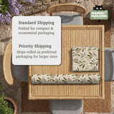 Green botanical mahjong mat with sage leaf and floral design and a scalloped edge.