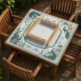 Teal square mahjong mat with peacock feathers, soft floral pattern, tassel details, and printed rule guide text in the center.