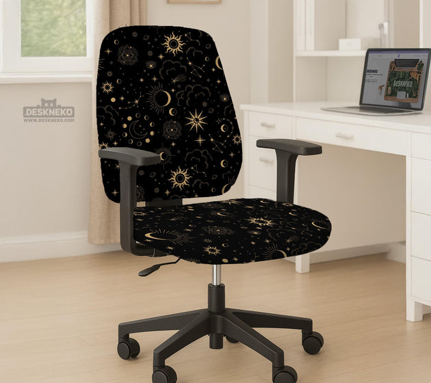 Black chair cover with gold moons, suns, stars, constellations, and line art printed across the fabric.