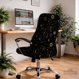 Black chair cover with gold moons, suns, stars, constellations, and line art printed across the fabric.