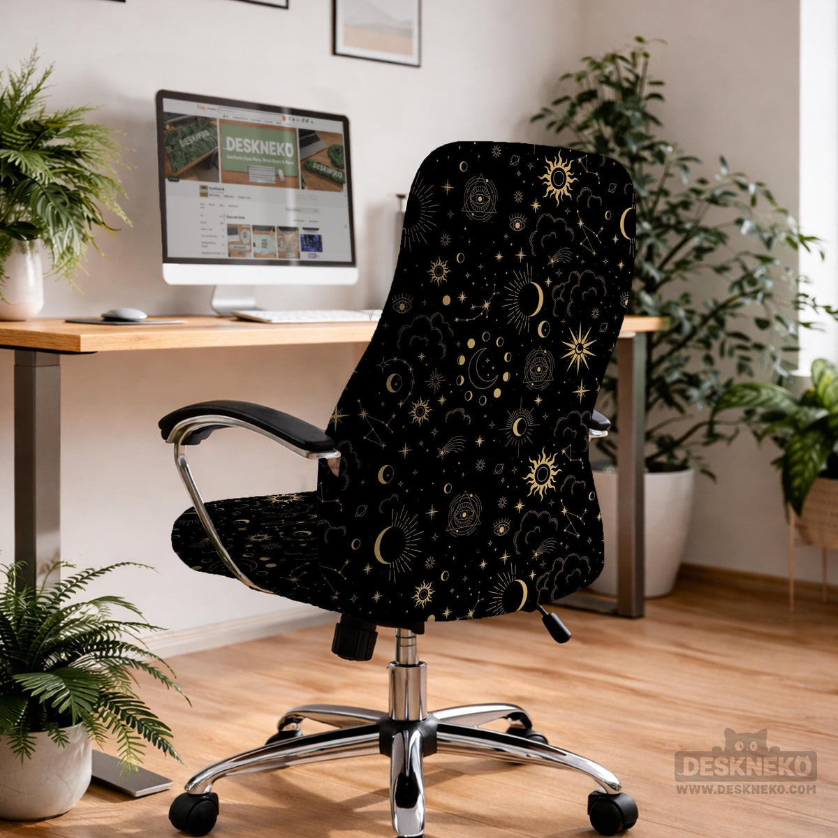 Black chair cover with a gold astrology print of moons, suns, stars, and symbols on a gaming chair.