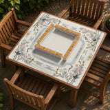 Beige square mahjong mat with a sage border, crane birds, bamboo, flowers, tile icons, and printed rules around a clean center play area.