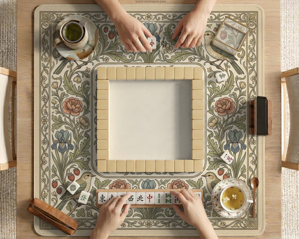 Square mahjong table mat with vintage bird artwork, floral border detail, and sage green, cream, muted blue, and terracotta tones.