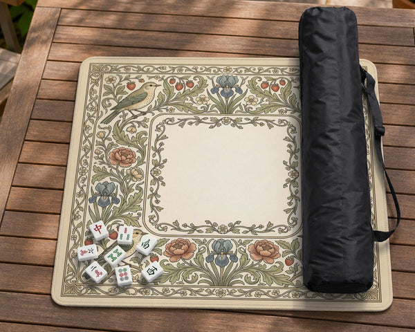 Square mahjong table mat with vintage bird artwork, floral border detail, and sage green, cream, muted blue, and terracotta tones.