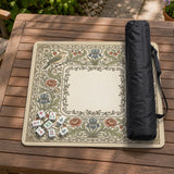 Square mahjong table mat with vintage bird artwork, floral border detail, and sage green, cream, muted blue, and terracotta tones.