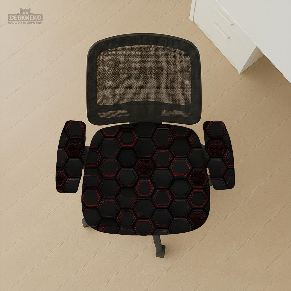 Black chair cover with a dark red geometric pattern shown on an office chair, with a fitted stretch look.