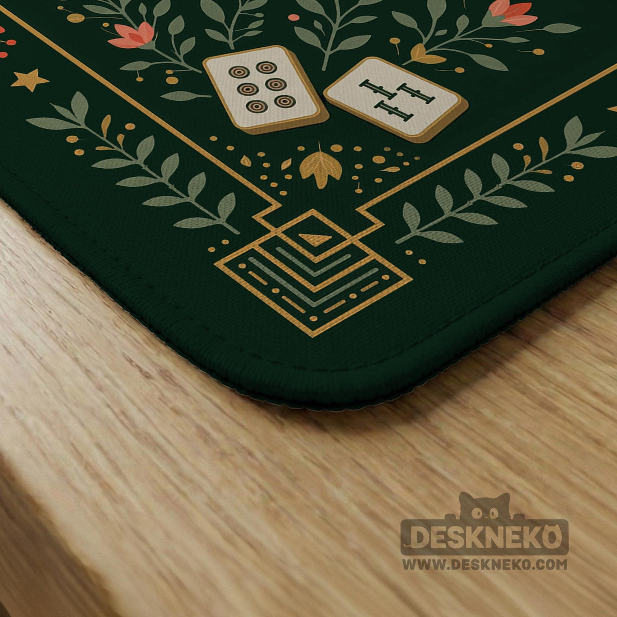 Dark botanical mahjong table mat with a floral border, large moth and butterfly design in the center, gold corner frame, and printed rules layout around the edge.