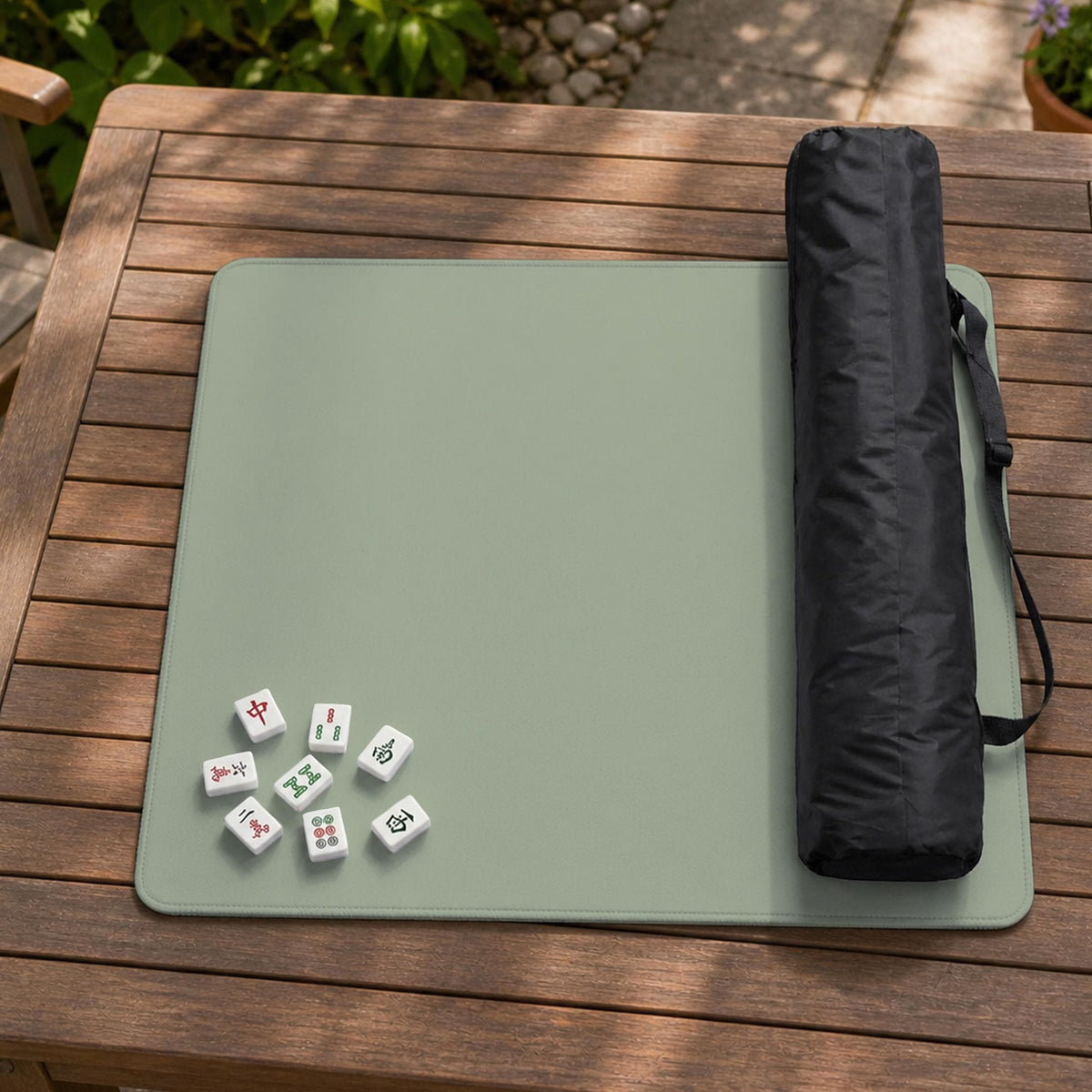 A plain light sage green square mahjong mat with a smooth solid-color surface.