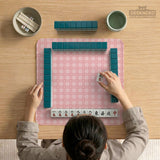 Pink checkered mahjong mat with small hearts and flowers.