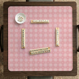 Pink checkered mahjong mat with small hearts and flowers.