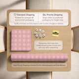 Pink checkered mahjong mat with small hearts and flowers.
