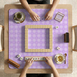 Lavender gingham mahjong mat with a scalloped edge and a pastel check pattern.