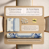 Blue and white mahjong table mat with a floral border, small birds, pagoda details, striped center, and printed rules around the edge.