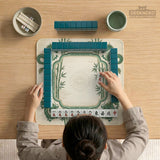 Sage green mahjong mat with a bamboo pattern, dragon design, printed rules around the edge, and a scalloped edge option.