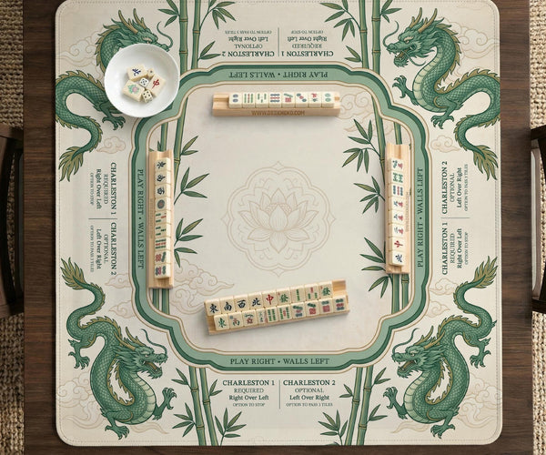 Sage green mahjong mat with a bamboo pattern, dragon design, printed rules around the edge, and a scalloped edge option.