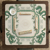 Sage green mahjong mat with a bamboo pattern, dragon design, printed rules around the edge, and a scalloped edge option.