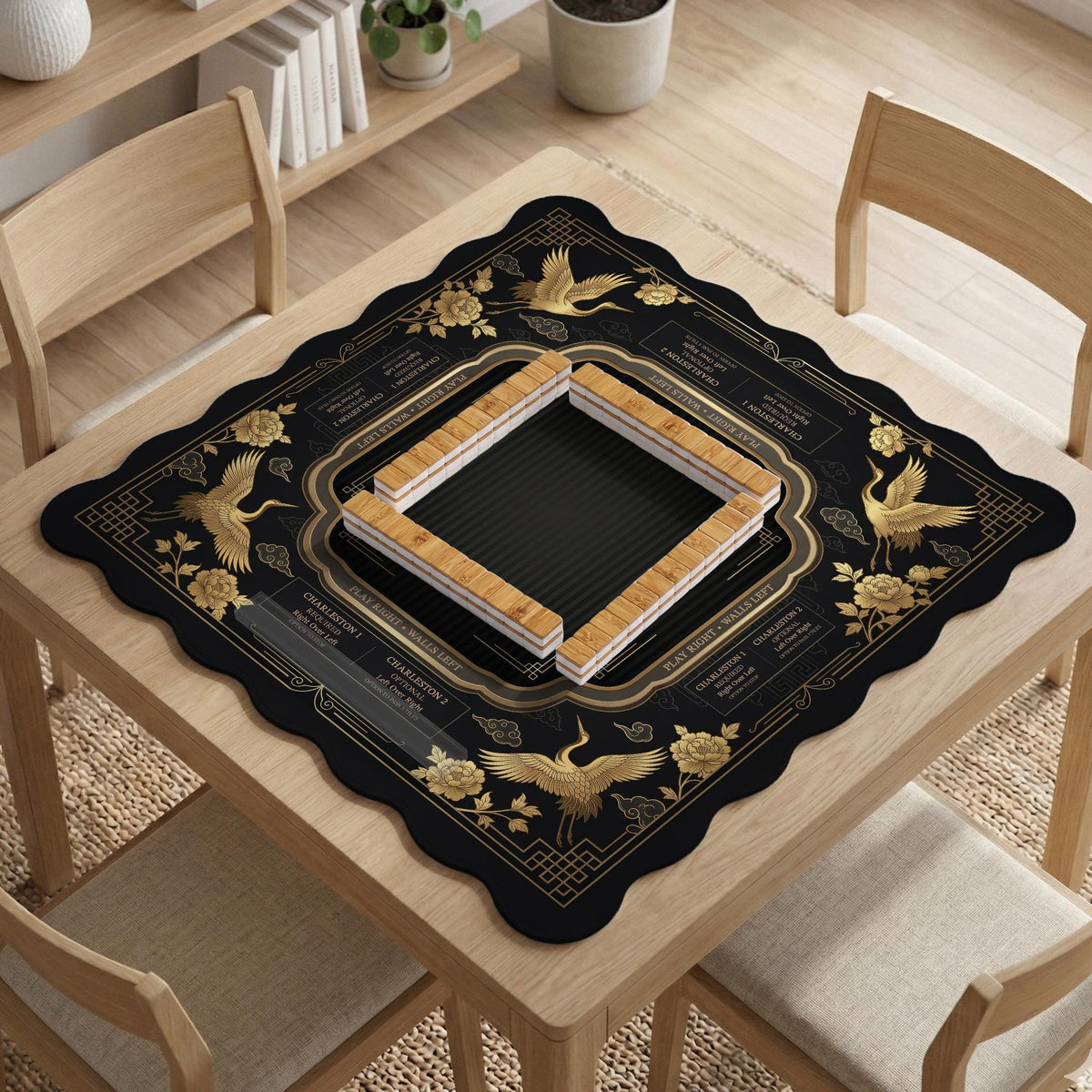 Black and gold square mahjong mat with an art deco crane and floral border, rule reminders around the edges, and a blank center area.