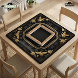 Black and gold square mahjong mat with an art deco crane and floral border, rule reminders around the edges, and a blank center area.