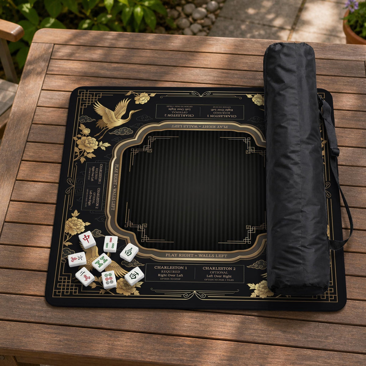 Black and gold square mahjong mat with an art deco crane and floral border, rule reminders around the edges, and a blank center area.