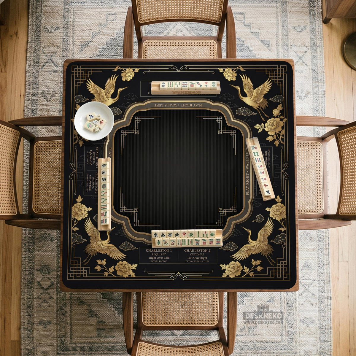 Black and gold square mahjong mat with an art deco crane and floral border, rule reminders around the edges, and a blank center area.
