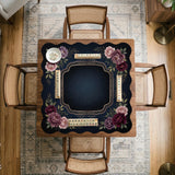 Burgundy mahjong mat with a floral border, gold botanical details, and printed American Mahjong rules on a dark background.