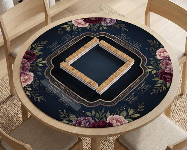 Burgundy mahjong mat with a floral border, gold botanical details, and printed American Mahjong rules on a dark background.