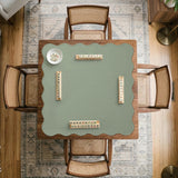 A square sage green mahjong mat with scalloped edges on a plain background.