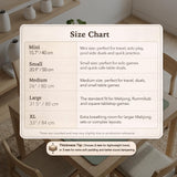 A square sage green mahjong mat with scalloped edges on a plain background.