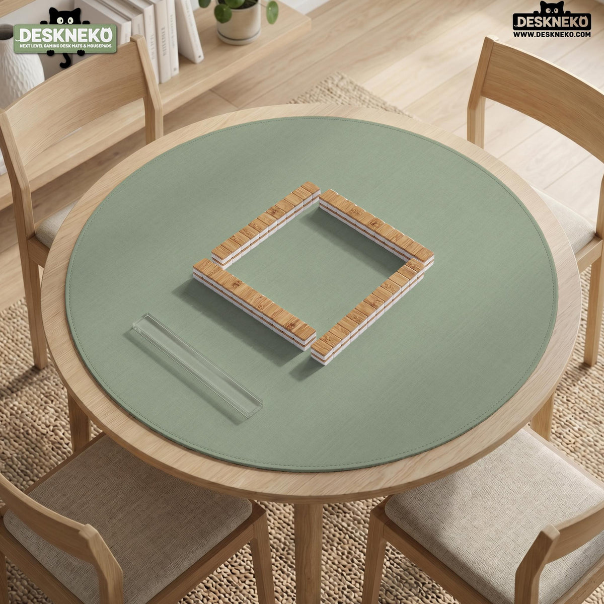 A square sage green mahjong mat with scalloped edges on a plain background.