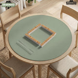 A square sage green mahjong mat with scalloped edges on a plain background.