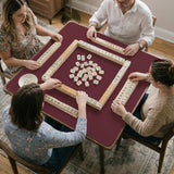Plain burgundy square mahjong mat with scalloped edges on a white background.