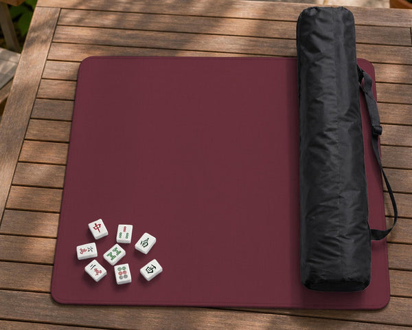 Plain burgundy square mahjong mat with scalloped edges on a white background.