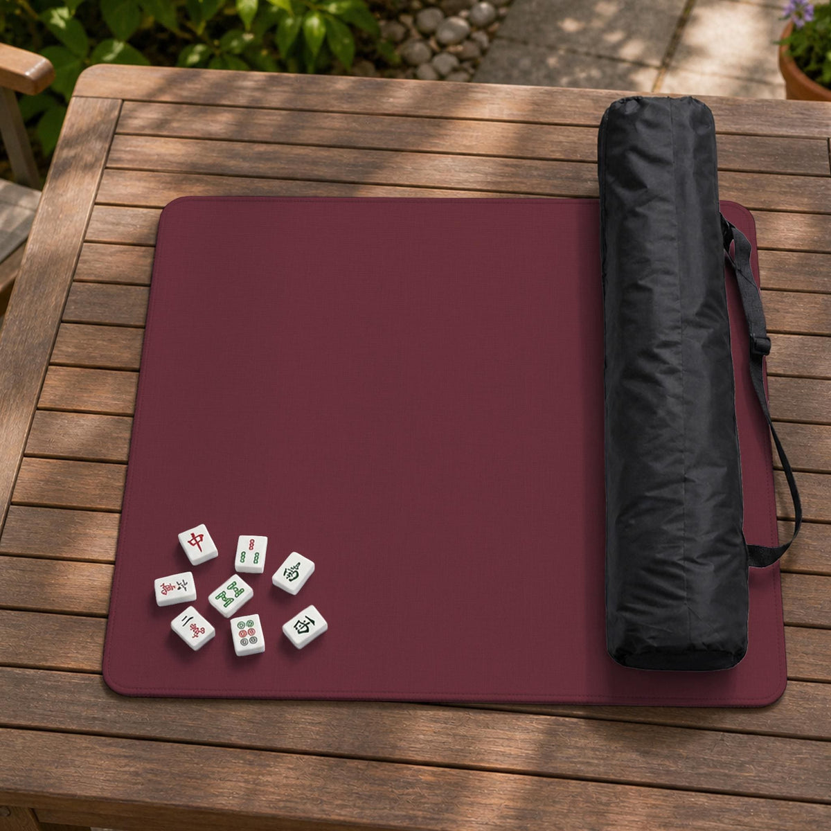 Plain burgundy square mahjong mat with scalloped edges on a white background.