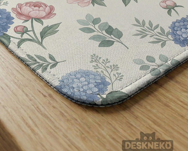 Pink floral mahjong table mat with peonies, blue hydrangeas, sage green leaves, and an ivory background.