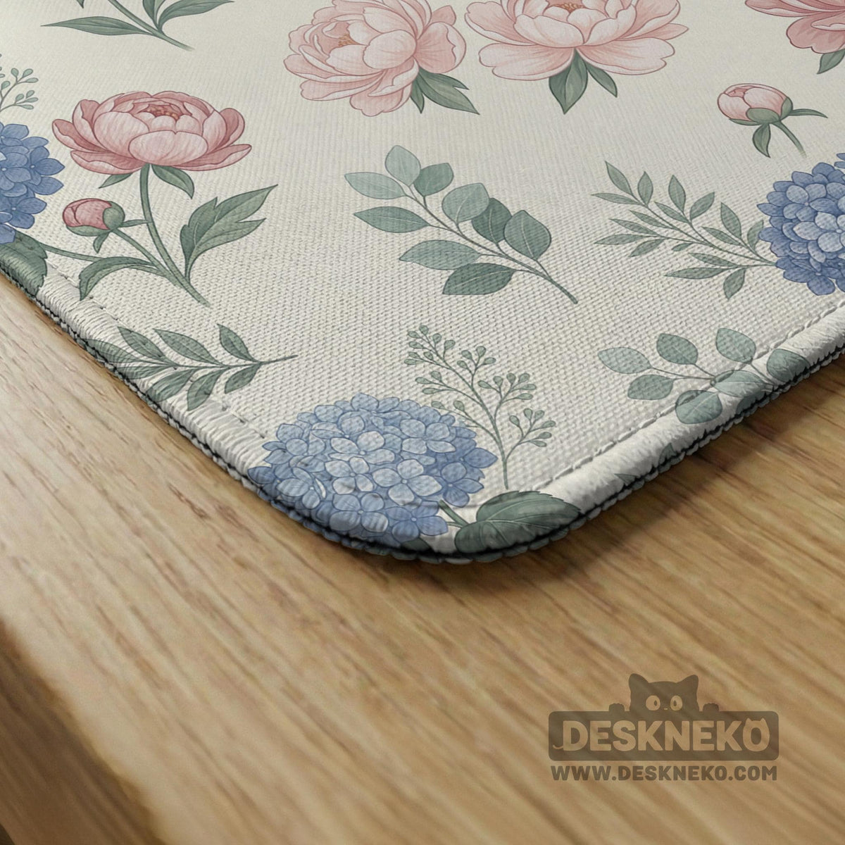 Pink floral mahjong table mat with peonies, blue hydrangeas, sage green leaves, and an ivory background.