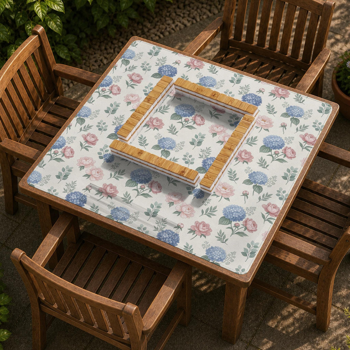 Pink floral mahjong table mat with peonies, blue hydrangeas, sage green leaves, and an ivory background.