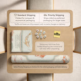 Sage and cream mahjong mat with a koi fish pond pattern, lotus blooms, water ripples, and printed instructions around the border. One version has a scalloped edge.