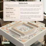 Sage and cream mahjong mat with a koi fish pond pattern, lotus blooms, water ripples, and printed instructions around the border. One version has a scalloped edge.