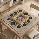 Beige mahjong mat with a botanical floral bird design, blush flowers, olive green leaves, black flower accents, and a warm linen-style background. Scalloped edge option shown.