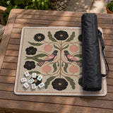 Beige mahjong mat with a botanical floral bird design, blush flowers, olive green leaves, black flower accents, and a warm linen-style background. Scalloped edge option shown.