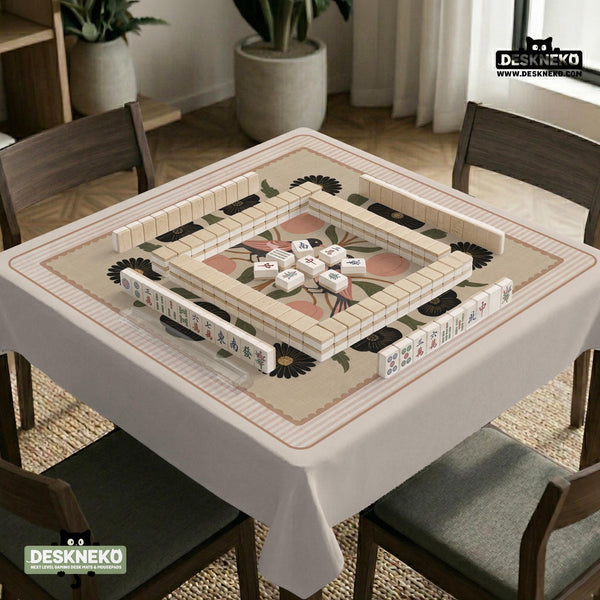 Beige mahjong mat with a botanical floral bird design, blush flowers, olive green leaves, black flower accents, and a warm linen-style background. Scalloped edge option shown.