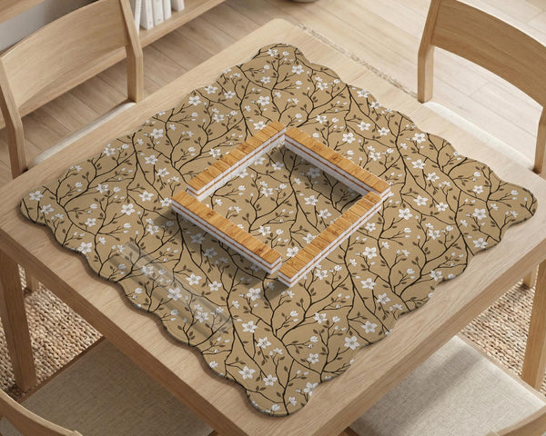 Beige mahjong mat with a white blossom branch floral pattern on a neutral background.