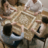 Beige mahjong mat with a white blossom branch floral pattern on a neutral background.