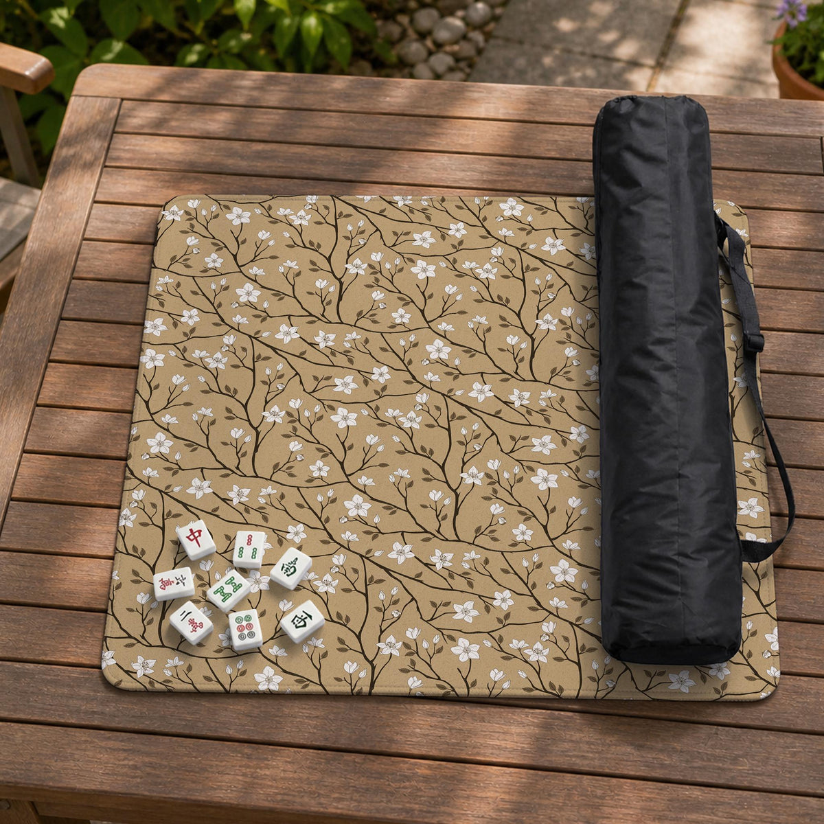 Beige mahjong mat with a white blossom branch floral pattern on a neutral background.