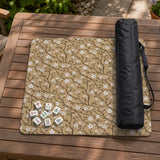 Beige mahjong mat with a white blossom branch floral pattern on a neutral background.