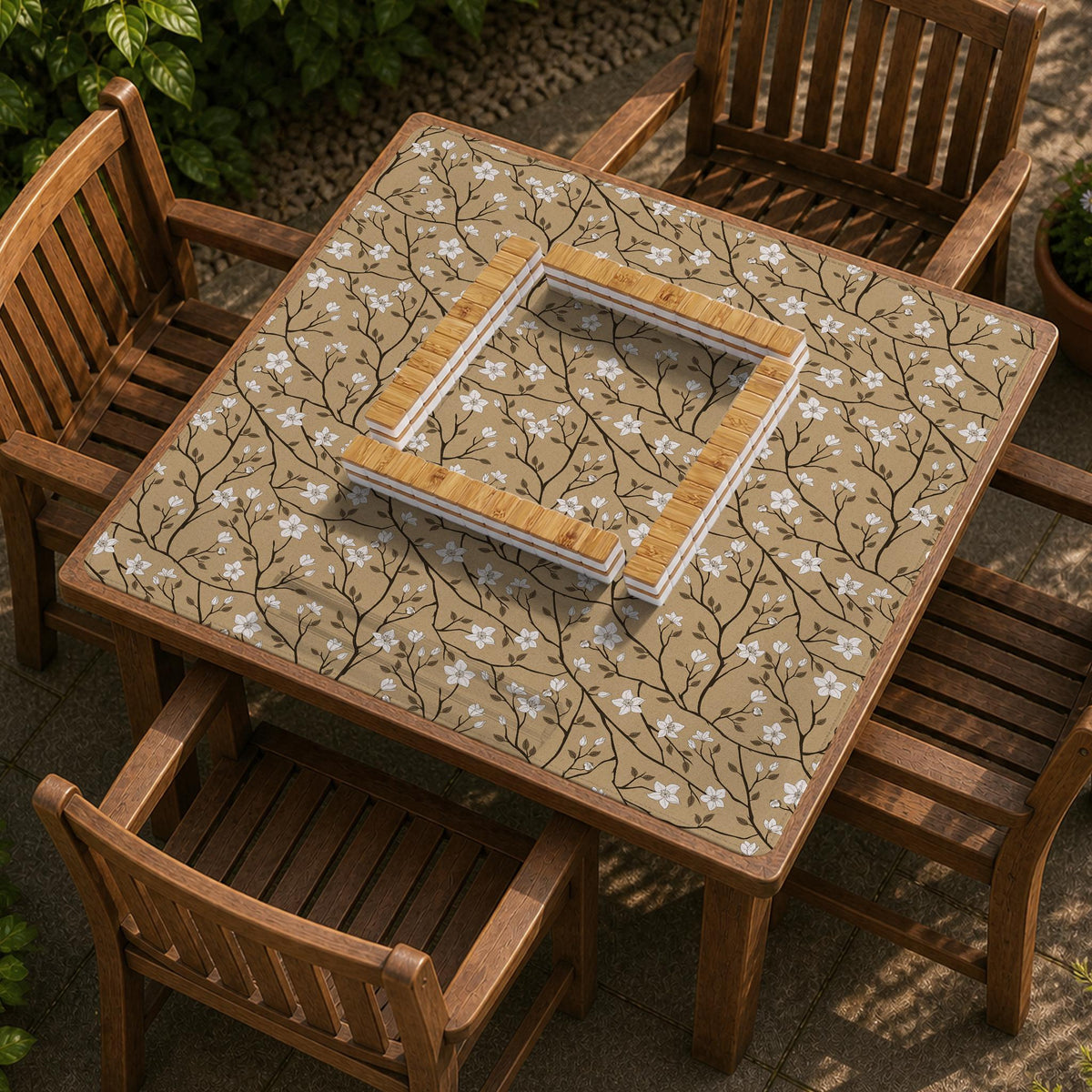 Beige mahjong mat with a white blossom branch floral pattern on a neutral background.