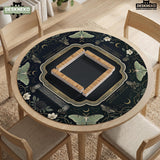 A dark floral mahjong mat with a scalloped edge, moth and flower artwork, and an American Mahjong rules layout on a dark background.